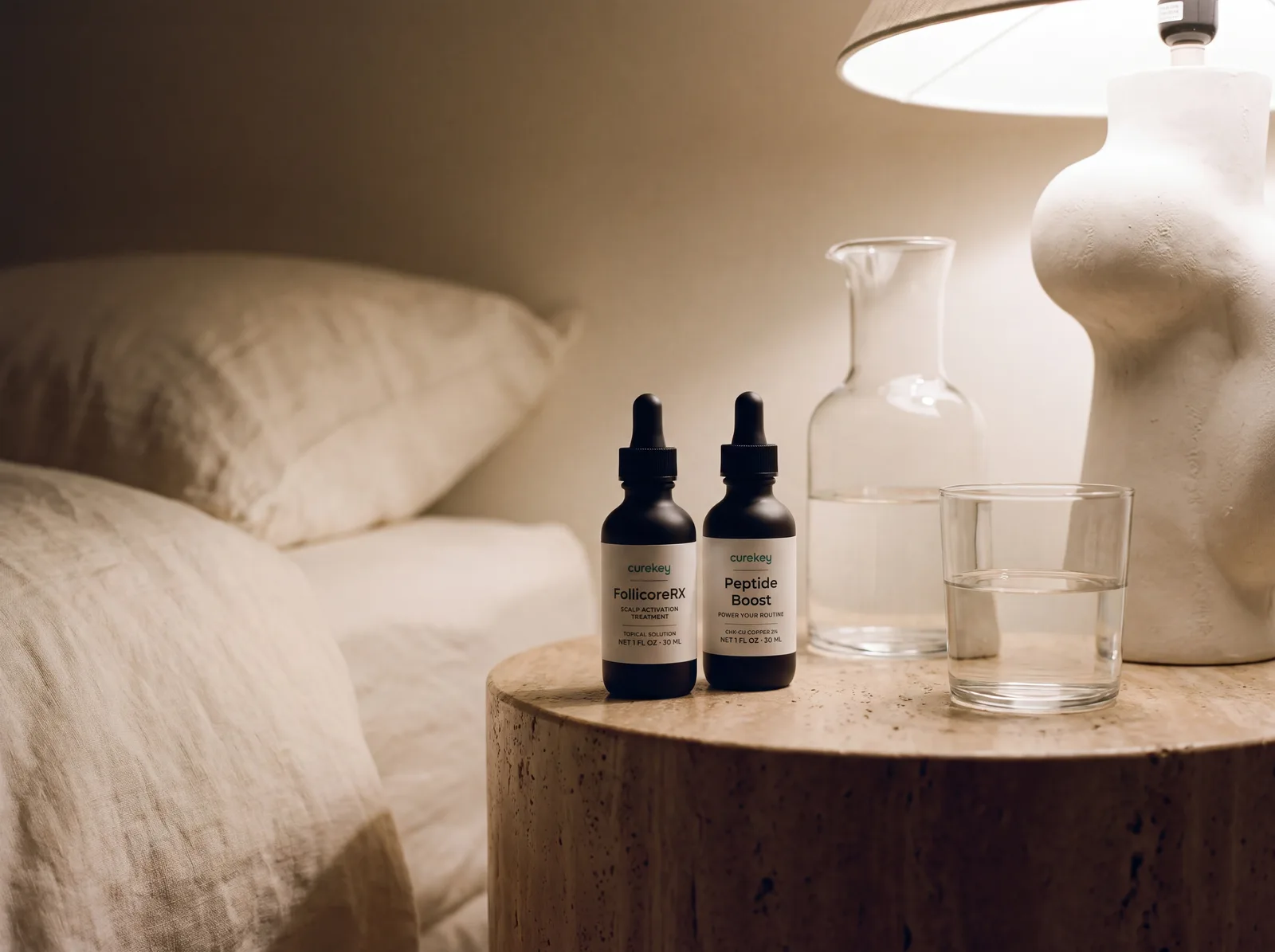 FollicoreRX and Peptide Boost on a travertine side table by the bed