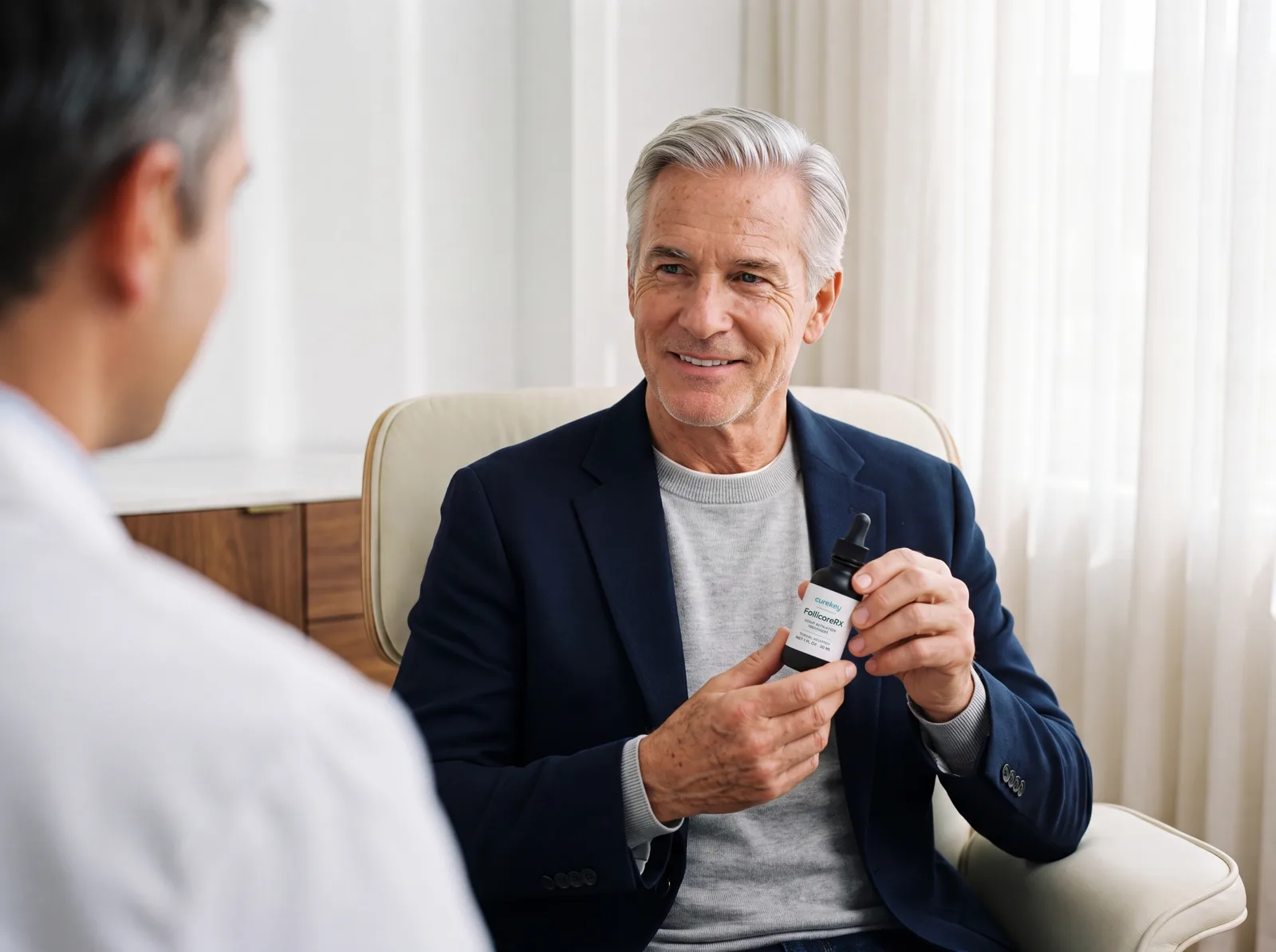 Smiling patient holding FollicoreRX while talking with a clinician